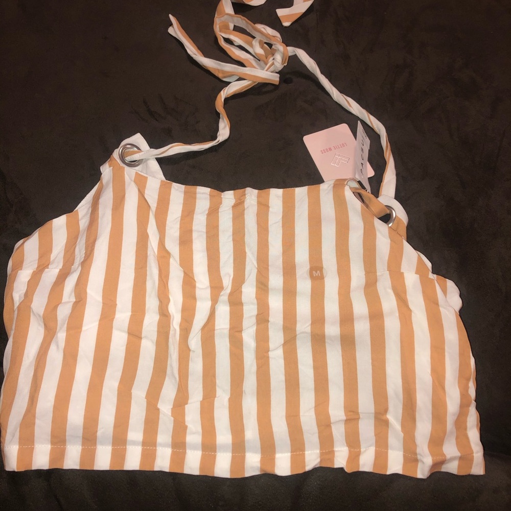 Crop tan top shows off back